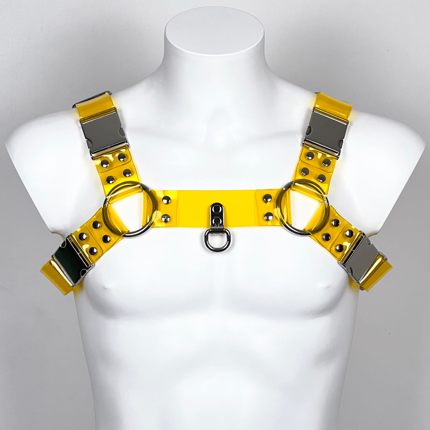 BDSM harness in yellow transparent PVC with metallic buckles